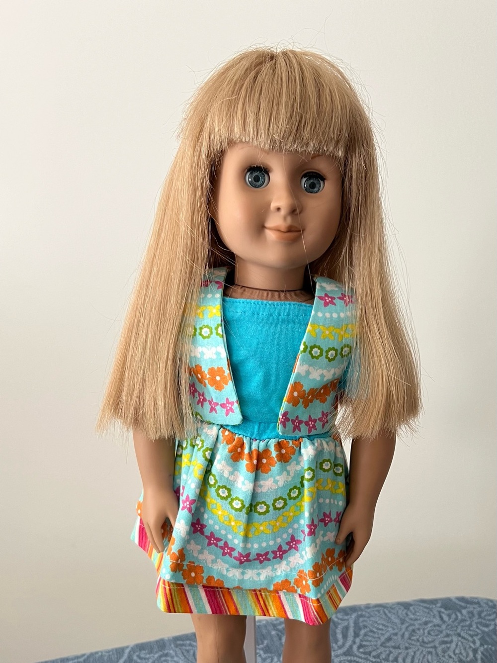 Blonde-Haired Kids Doll in Turquoise & Multi-Color Floral Outfit